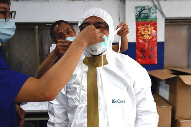 May 29, 2021, Taipei, Taipei, Taiwan: A special quarantine bus driver puts on a PPE at a fire station, where buses and taxis that carried quarantined persons are spread with disinfectant, before delivering citizens who have completed their quarantine, following a surge of domestic COVID-19 cases. The number of domestic COVID-19 cases particularly in Taipei has surged, with disinfection being intensified across the country to minimize transmission. Taipei Taiwan - ZUMAs313 20210529_zip_s313_021 Copyright: xDanielxCengxShou-Yix