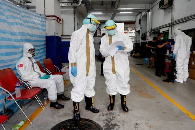 May 29, 2021, Taipei, Taipei, Taiwan: A military officer prepares for transport disinfection whereas special quarantine bus discuss the delivery plan at a fire station, where buses and taxis that carried quarantined persons are spread with disinfectant, following a surge of domestic COVID-19 cases. According to the soldier, he and his teammates have to disinfect several buses and 20 taxies, alternative, as more people are tested positive for COVID-19 amid a domestic outbreak. Taipei Taiwan - ZUMAs313 20210529_zip_s313_024 Copyright: xDanielxCengxShou-Yix