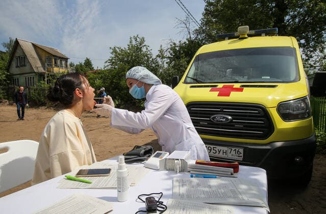 TATARSTAN, RUSSIA - MAY 29, 2021: A man visits a mobile health unit to receive an injection of the Gam-COVID-Vac (Sputnik V) vaccine against COVID-19 on the premises of the Volga gardening partnership. Yegor Aleyev TASS  TS102043