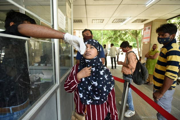 NOIDA, INDIA - MAY 28: A health worker collects a swab sample for Covid-19 test, at a district hospital in Sector 30, on May 28, 2021 in Noida, India. (Photo by Sunil Ghosh Hindustan Times) Medical Team Conducts COVID-19 Coronavirus Test