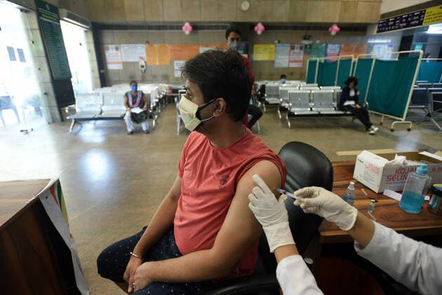 NOIDA, INDIA - MAY 28: A health worker administers a Covid-19 vaccine to a beneficiary at sector 30 district hospital, on May 28, 2021 in Noida, India. (Photo by Sunil Ghosh Hindustan Times) COVID-19 Vaccination Drive