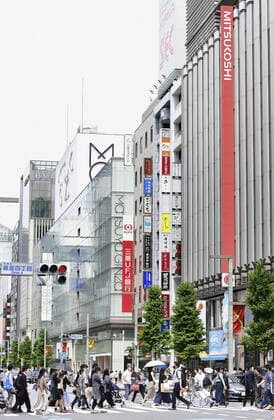 Tokyo under COVID-19 emergency People wearing face masks walk on a crossing in Tokyo s Ginza area on May 29, 2021, as a COVID-19 state of emergency remains in place in the capital. 