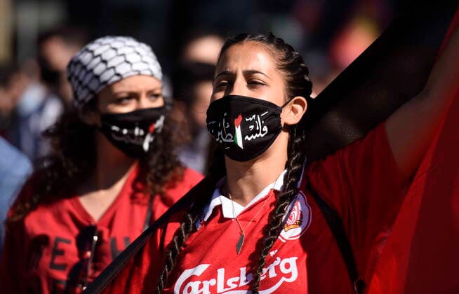 May 29, 2021, Ottawa, on, Canada: People wear masks with the shape and colours of Palestine as they participate in a rally in Ottawa to denounce Israel s military actions in the Palestinian territories, on Saturday, May 29, 2021. Ottawa Canada  - ZUMAc35_ 20210529_zaf_c35_012 Copyright: xJustinxTangx