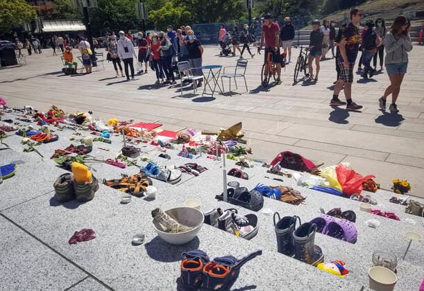 (210530) -- VANCOUVER, May 30, 2021 -- Children s shoes are placed on the staircase outside Vancouver Art Gallery during a memorial event for the 215 children whose remains have been found buried at a former Kamloops residential school in Vancouver, British Columbia, Canada, May 29, 2021. The reported discovery of the remains of 215 indigenous children at a former residential school in Kamloops in western Canada has shocked Canadian people. In a press release on Friday, the British Columbia Assembly of First Nations said it is grieving the location of the 215 children. (Photo by Xinhua) CANADA-VANCOUVER-KAMLOOPS INDIGENOUS SCHOOL-CHILDREN REMAINS-MEMORIAL LiangxSen 