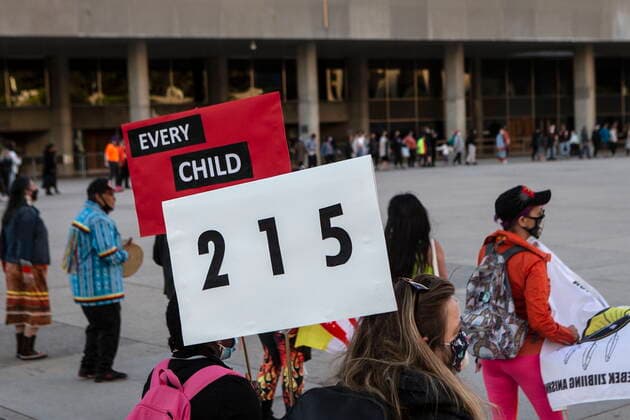 May 30, 2021, Toronto, on, Canada: People form a circle during a vigil in Toronto on Sunday May 30, 2021, for the 215 Indigenous children, whose remains were uncovered on the grounds of a former residential school near Kamloops, British Columbia. The discovery of a mass grave was announced late on Thursday by the TkÃ¢â‚¬â ¢emlups te Secwo pemc people after the site was examined by a team using ground-penetrating radar. Toronto Canada  - ZUMAc35_ 20210530_zaf_c35_093 Copyright: xChrisxYoungx