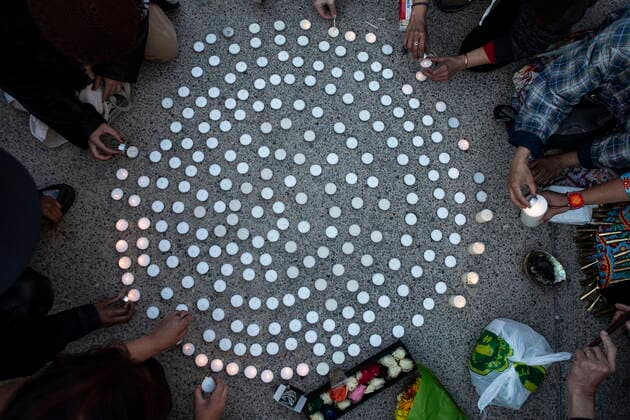 May 30, 2021, Toronto, on, Canada: Candles are lit during a vigil in Toronto on Sunday May 30, 2021, for the 215 Indigenous children, whose remains were uncovered on the grounds of a former residential school near Kamloops, British Columbia. The discovery of a mass grave was announced late on Thursday by the TkÃ¢â‚¬â ¢emlups te Secwo pemc people after the site was examined by a team using ground-penetrating radar. Toronto Canada  - ZUMAc35_ 20210530_zaf_c35_097 Copyright: xChrisxYoungx