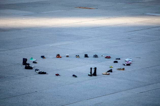 May 30, 2021, Toronto, on, Canada: Children shoes are left in a circle during a vigil in Toronto on Sunday May 30, 2021, for the 215 Indigenous children, whose remains were uncovered on the grounds of a former residential school near Kamloops, British Columbia. The discovery of a mass grave was announced late on Thursday by the TkÃ¢â‚¬â ¢emlups te Secwo pemc people after the site was examined by a team using ground-penetrating radar. Toronto Canada  - ZUMAc35_ 20210530_zaf_c35_098 Copyright: xChrisxYoungx