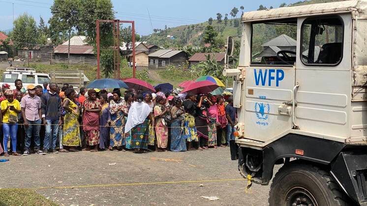(210531) -- SAKE (DRC), May 31, 2021 -- People wait to get aid delivered by humanitarian organizations in Sake, North Kivu province, Democratic Republic of Congo (DRC), May 31, 2021. Several humanitarian organizations have began distributing aid to displaced people in Sake, in North Kivu province in northeastern Democratic Republic of Congo, following the eruption of Nyiragongo volcano on May 22. Supported by the World Food Program, these humanitarian organizations have distributed beans, maize and other supplies to thousands of the displaced. (Photo by Xinhua) DRC-SAKE-REFUGE-AID AlainxUyakani 