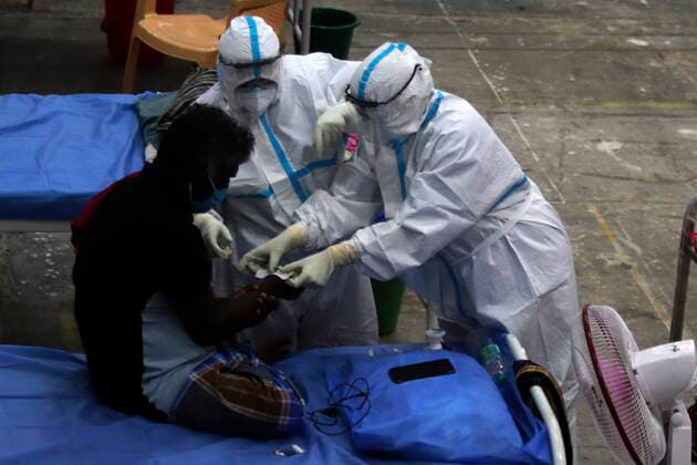 May 31, 2021, Chennai, Tamil Nadu, India: A health worker in PPE attends a Covid-19 patient at a temporary isolation centre built in Chennai Trade Centre for the Covid-19 coronavirus patients in Chennai. Chennai India - ZUMA CEN 20210531_mda_l172_184 Copyright: xSrixLoganathanx