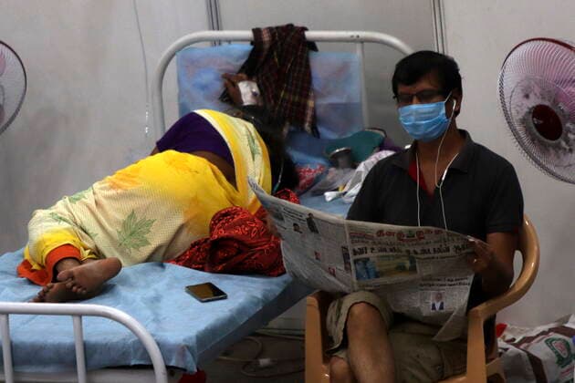 May 31, 2021, Chennai, Tamil Nadu, India: A Covid-19 corona virus patient seen reading newspaper at a temporary isolation centre built in Chennai Trade Centre for the Covid-19 coronavirus patients in Chennai. Chennai India - ZUMA CEN 20210531_mda_l172_186 Copyright: xSrixLoganathanx