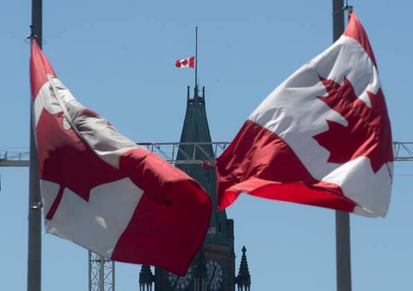 May 31, 2021, Ottawa, on, Canada: Canadian flags fly at half mast on the Peace tower and around the city Monday May 31, 2021 in Ottawa. The flags have been lowered indefinitely to recognize the discovery of children s remains at the former Kamloops Indian Residential school. Ottawa Canada  - ZUMAc35_ 20210531_zaf_c35_036 Copyright: xAdrianxWyldx