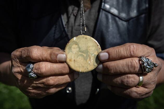 May 31, 2021, Kamloops, BC, Canada: Kamloops Indian Residential School survivor Clayton Peters, 64, who was forced into the school for 10 years, holds a faded photograph of his parents, Nancy and Pete Peters and his older sister Nancy Rose, that he wears around his neck, while visiting the former school in Kamloops, B.C., on Monday, May 31, 2021. Peters parents and his brothers were also forced into the facility. The remains of 215 children have been discovered buried near the former school. Kamloops Canada  - ZUMAc35_ 20210531_zaf_c35_069 Copyright: xDarrylxDyckx