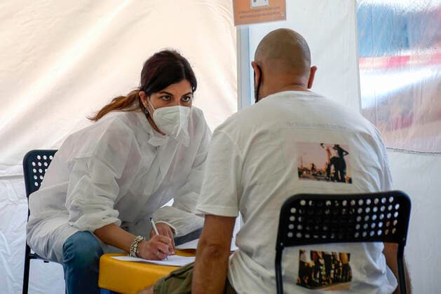 June 1, 2021, Rome, Italy: A health worker takes a medical history of a man before administering the Johnson & Johnson COVID-19 vaccine inside a gazebo..From today 1 June, vaccinations against Coronavirus COVID 19 in pharmacies have begun in Italy. Rome Italy - ZUMAs197 20210601_zaa_s197_012 Copyright: xVincenzoxNuzzolesex