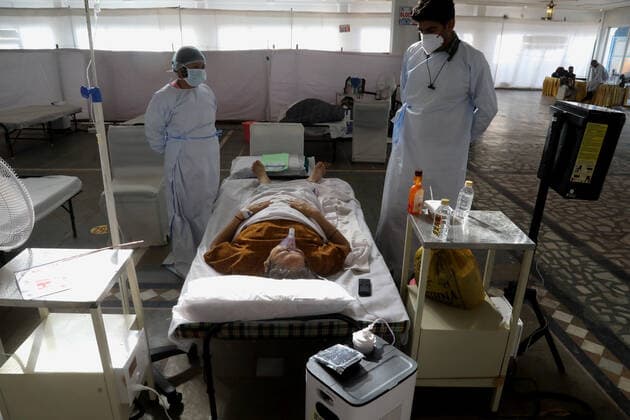 June 1, 2021, New Delhi, India: Healthcare workers attending to a Covid-19 suspected patient wearing oxygen mask at the covid-19 care center..All 38 Jewish people from Manipur (State in Northeastern India) supposed to leave for Israel but could not catch the flight after being detected Covid-19 positive..The Guru Teg Bahadur covid-19 Care Centre has 400 beds with all facility equipped with essential oxygen support and medicine for the patient at free of cost only for those with an oxygen saturation level of 85 and above can be admitted, set up by Delhi Sikh Gurudwara Management Committee (DSGMC) with the help from International Aid organizations and Delhi government. New Delhi India - ZUMAs197 20210601_zaa_s197_178 Copyright: xNaveenxSharmax