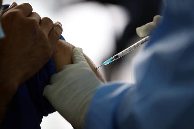 June 1, 2021 - Tegucigalpa , Honduras - A person is vaccinated against covid-19. Tegucigalpa, Honduras. Hundreds of people who contribute to the (IHSS) Honduran Social Security Institute approach vaccination centers to receive the first dose of the Astrazeneca vaccine against covid-19, Honduras so far has 238,227 positive cases and 6,353 deaths. Tegucigalpa Honduras  - ZUMAf149 20210601_int_f149_004 Copyright: xMiloxEspinozax