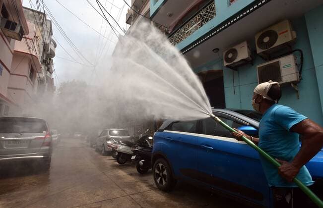 NEW DELHI, INDIA - JUNE 1: North Delhi municipal corporation workers sprays sanitizer during the special sanitization drive after the unlock of lockdown imposed amid the surge in coronavirus cases, at Prabhat Road residence Colony Karol bagh on June 1, 2021 in New Delhi, India. (Photo by Sonu Mehta Hindustan Times) Sanitation Drive To Curb The Covid-19 Pandemic