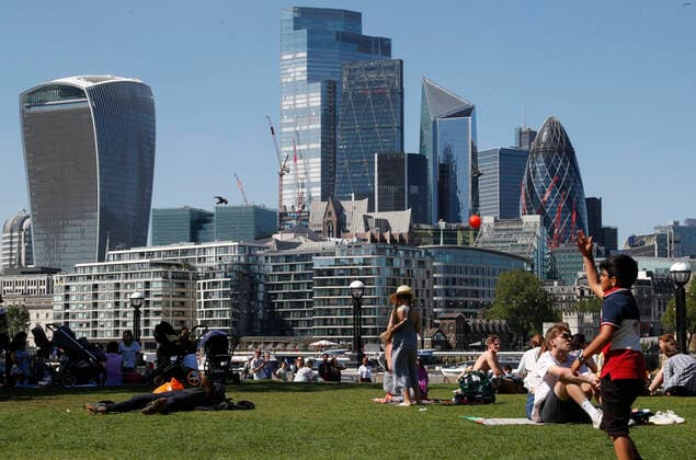 (210602) -- LONDON, June 2, 2021 -- People enjoy sunshine, backdropped by the City of London buildings in London, Britain, June 1, 2021. Britain remains in a vulnerable position in fighting coronavirus despite the progress of the country s vaccination program, a scientist advising the British government said Tuesday. Professor Adam Finn from the Joint Committee on Vaccination and Immunisation, which advises the government on vaccine priority, said the job to contain the pandemic is not done as large numbers of people are still unvaccinated. ) BRITAIN-LONDON-COVID-19 HanxYan 