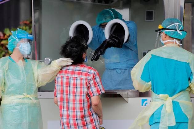 Virus Outbreak Taiwan A lady gets a rapid COVID-19 test at a testing center in New Taipei, following a surge of domestic cases and deaths, in New Taipei, Taiwan, 2 June 2021. The country has been facing a shortage of vaccines alongside the impact on its economy caused by the pandemic. Taipei Taiwan ceng-notitle210602_npUWC  Copyright: xCengxShouxYix