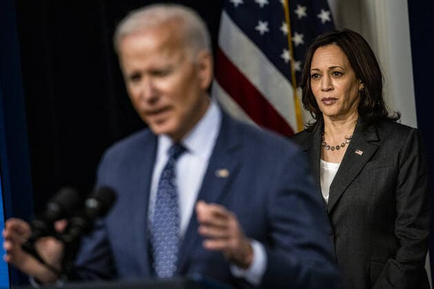 U.S. Vice President Kamala Harris listens as U.S. President Joe Biden speaks in the Eisenhower Executive Office Building in Washington, DC on Wednesday, June 2, 2021. Biden announced a plan to work with churches, colleges, businesses and celebrities to boost coronavirus vaccinations in the U.S. where demand for the shots has faltered.  WAX20210602824 SamuelxCorum