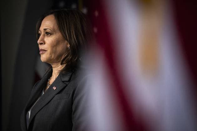 U.S. Vice President Kamala Harris listens as U.S. President Joe Biden speaks in the Eisenhower Executive Office Building in Washington, DC on Wednesday, June 2, 2021. Biden announced a plan to work with churches, colleges, businesses and celebrities to boost coronavirus vaccinations in the U.S. where demand for the shots has faltered.  WAX20210602825 SamuelxCorum