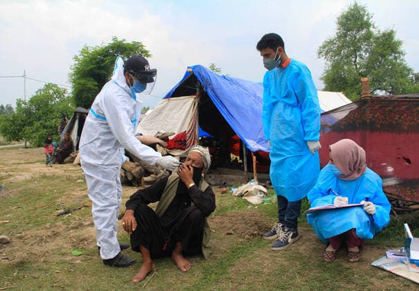 June 3, 2021, Srinagar, Jammu and Kashmir, India: Kashmiri doctor in a protective suit takes a nasal swab samples of a nomad to test for COVID-19 in outskirts of Srinagar, Jammu and Kashmir. Srinagar India - ZUMAs260 20210603_zip_s260_006 Copyright: xSajadxHameedx