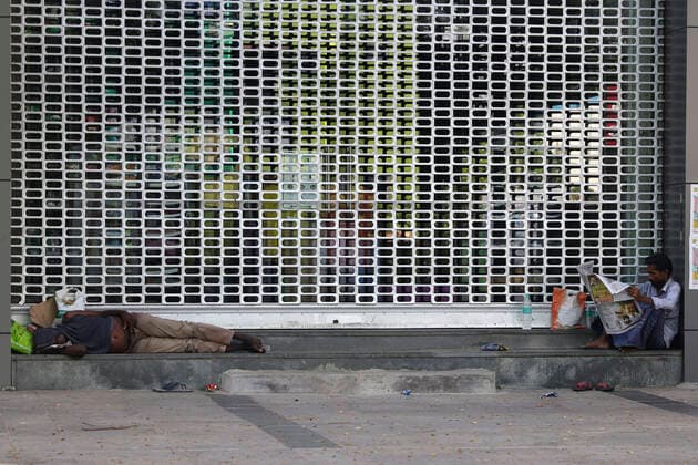 June 3, 2021, Chennai, Tamil Nadu, India: A man takes a nap amid closed shops during the lockdown imposed as a preventive measure against the spread of the Covid-19 coronavirus in Chennai. Chennai India - ZUMAl172 20210603_zip_l172_003 Copyright: xSrixLoganathanx