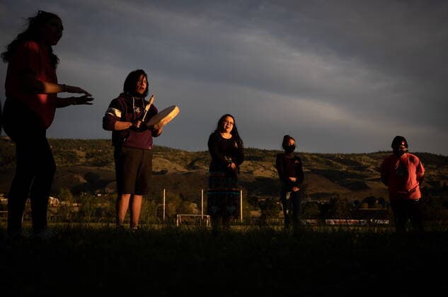 June 4, 2021, Kamloops, BC, Canada: A group of youths lead a group drumming and singing at sunset outside the former Kamloops Indian Residential School, to honour the 215 children whose remains have been discovered buried near the facility, in Kamloops, B.C., on Friday, June 4, 2021. Kamloops Canada - ZUMAc35_ 20210604_zaf_c35_158 Copyright: xDarrylxDyckx