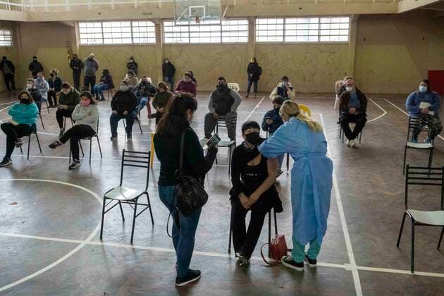 June 5, 2021, Firmat, Santa Fe, Argentina: Inside a makeshift vaccination center in a basketball court, a woman gets a shot of COVID-19 AstraZeneca vaccine. Firmat Argentina - ZUMAm105 20210605_zaf_m105_007 Copyright: xPatricioxMurphyx
