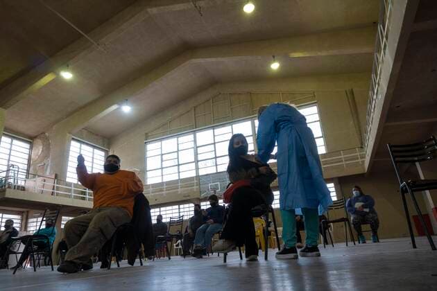 June 5, 2021, Firmat, Santa Fe, Argentina: Inside a makeshift vaccination center in a basketball court, a woman gets a shot of COVID-19 AstraZeneca vaccine. Firmat Argentina - ZUMAm105 20210605_zaf_m105_009 Copyright: xPatricioxMurphyx