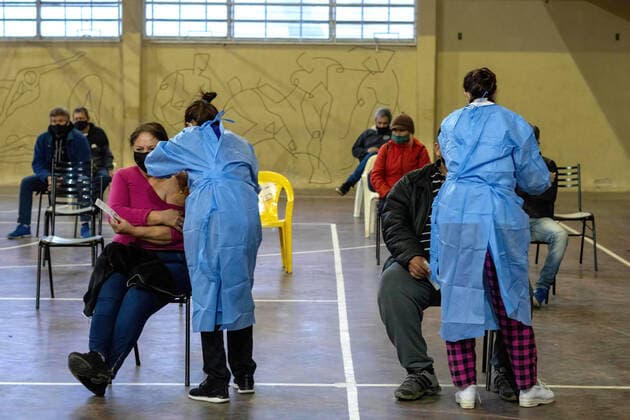 June 5, 2021, Firmat, Santa Fe, Argentina: Two people get vaccinated with a dose of Sputnik v vaccine Inside a makeshift vaccination center at a basketball court..Argentina carries on with an ambitious immunization programme, and as local production of Sputnik V vaccine starts, the country is also receiving a steady flow of vaccines. Firmat Argentina - ZUMAs197 20210605_zaa_s197_127 Copyright: xPatricioxMurphyx