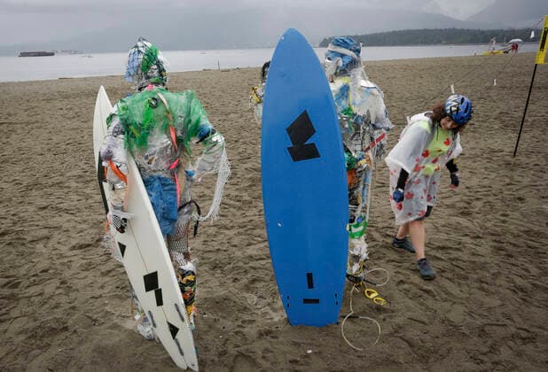 (210606) -- VANCOUVER, June 6, 2021 -- Figures made with plastics removed from shorelines are displayed at Kitsilano Beach in Vancouver, British Columbia, Canada, on June 6, 2021. Created by multidisciplinary artist Caitlin Doherty and made with plastics removed from Canadian shorelines, a set of figures named plastic beachgoers embody people s collective contribution to plastic pollution, bring the topic of shoreline pollution to the forefront. (Photo by Xinhua) CANADA-VANCOUVER-INSTALLATIONS-PLASTIC BEACHGOERS LiangxSen 