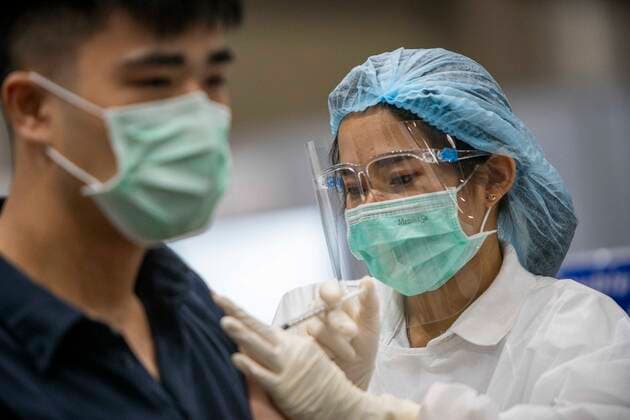 June 7, 2021, Bangkok, Bangkok, Thailand: Medical personnel administers a locally produced AstraZeneca vaccine shot to a member of the public in a vaccination center inside BangkokÃ¢â‚¬â ¢s upscale Siam Paragon shopping mall. The mass effort to vaccinate ThailandÃ¢â‚¬â ¢s population against the novel coronavirus started on Monday, June 7th with hundreds of vaccination centers having been set up in the nationÃ¢â‚¬â ¢s capitol Bangkok and nationwide. Both imported Chinese made Sinovac and domestically produced AstraZeneca vaccine injections are being used, with a goal set the inoculate 70% of the population by the end of the year to achieve herd immunity. Bangkok Thailand - ZUMAt128 20210607_zap_t128_004 Copyright: xAdryelxTalamantesx