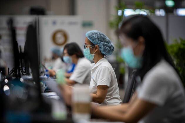 June 7, 2021, Bangkok, Bangkok, Thailand: Medical personnel review vaccine registration information in a vaccination center inside BangkokÃ¢â‚¬â ¢s upscale Siam Paragon shopping mall. The mass effort to vaccinate ThailandÃ¢â‚¬â ¢s population against the novel coronavirus started on Monday, June 7th with hundreds of vaccination centers having been set up in the nationÃ¢â‚¬â ¢s capitol Bangkok and nationwide. Both imported Chinese made Sinovac and domestically produced AstraZeneca vaccine injections are being used, with a goal set the inoculate 70% of the population by the end of the year to achieve herd immunity. Bangkok Thailand - ZUMAt128 20210607_zap_t128_009 Copyright: xAdryelxTalamantesx