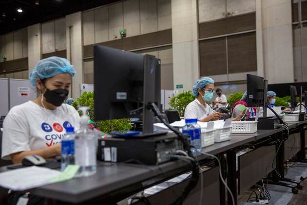 June 7, 2021, Bangkok, Bangkok, Thailand: Medical personnel review vaccine registration information in a vaccination center inside BangkokÃ¢â‚¬â ¢s upscale Siam Paragon shopping mall. The mass effort to vaccinate ThailandÃ¢â‚¬â ¢s population against the novel coronavirus started on Monday, June 7th with hundreds of vaccination centers having been set up in the nationÃ¢â‚¬â ¢s capitol Bangkok and nationwide. Both imported Chinese made Sinovac and domestically produced AstraZeneca vaccine injections are being used, with a goal set the inoculate 70% of the population by the end of the year to achieve herd immunity. Bangkok Thailand - ZUMAt128 20210607_zap_t128_012 Copyright: xAdryelxTalamantesx
