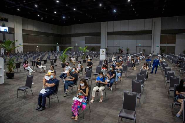 June 7, 2021, Bangkok, Bangkok, Thailand: Members of the public wait to receive the Thai manufactured AstraZeneca vaccine inside a convention hall in BangkokÃ¢â‚¬â ¢s upscale Siam Paragon shopping mall. The mass effort to vaccinate ThailandÃ¢â‚¬â ¢s population against the novel coronavirus started on Monday, June 7th with hundreds of vaccination centers having been set up in the nationÃ¢â‚¬â ¢s capitol Bangkok and nationwide. Both imported Chinese made Sinovac and domestically produced AstraZeneca vaccine injections are being used, with a goal set the inoculate 70% of the population by the end of the year to achieve herd immunity. Bangkok Thailand - ZUMAt128 20210607_zap_t128_014 Copyright: xAdryelxTalamantesx