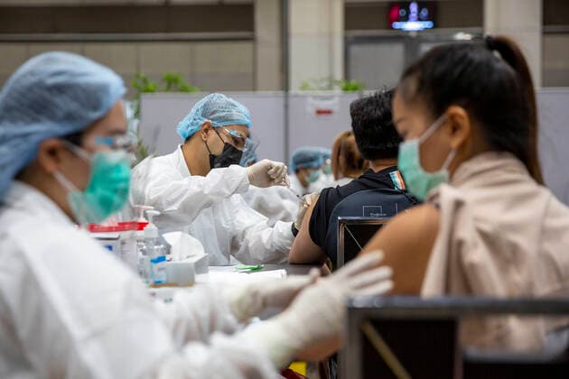 June 7, 2021, Bangkok, Bangkok, Thailand: Medical personnel administers a locally produced AstraZeneca vaccine shot to a member of the public in a vaccination center inside BangkokÃ¢â‚¬â ¢s upscale Siam Paragon shopping mall. The mass effort to vaccinate ThailandÃ¢â‚¬â ¢s population against the novel coronavirus started on Monday, June 7th with hundreds of vaccination centers having been set up in the nationÃ¢â‚¬â ¢s capitol Bangkok and nationwide. Both imported Chinese made Sinovac and domestically produced AstraZeneca vaccine injections are being used, with a goal set the inoculate 70% of the population by the end of the year to achieve herd immunity. Bangkok Thailand - ZUMAt128 20210607_zap_t128_017 Copyright: xAdryelxTalamantesx