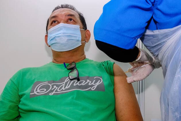 June 7, 2021, Shah Alam, Malaysia: A health worker administers a first dose of Sinovac vaccine to a person at Uitm Puncak Alam, Selangor..Malaysia Health Minister, Dr Adham Baba said Malaysia has delivered 3.57million Covid-19 vaccine shots and more than one million individuals had received two doses of the vaccine. Kuala Lumpur had the highest vaccine recipient with 508,358 Covid-19 vaccine shots involves and followed by Selangor at 398,697 shots. Shah Alam Malaysia - ZUMAs197 20210607_zaa_s197_104 Copyright: xFarisxHadziqx