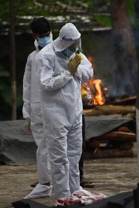 June 7, 2021, Guwahati, Guwahati, India: Family members perform the last rites of COVID-19 victim at cremation ground in Guwahati Assam India on Monday 7th June 2021. Guwahati India - ZUMAd163 20210607_zip_d163_002 Copyright: xDasarathxDekax