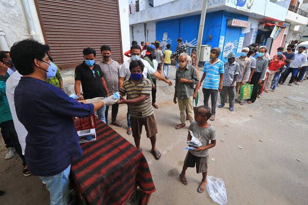Food Distribution During Lockdown In Jaipur Social workers Dr. Sarvesh S Joshi and Deepak Dandoriya distributed free food packets and face mask to needy people during the Covid-19 lockdown ,at Purani Basti in Jaipur, Rajasthan, India, on June 07, 2021. Jaipur Rajasthan India bhatnagar-notitle210607_npWMH  Copyright: xVishalxBhatnagarx