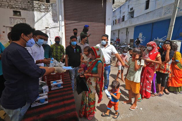 Food Distribution During Lockdown In Jaipur Social workers Dr. Sarvesh S Joshi and Deepak Dandoriya distributed free food packets and face mask to needy people during the Covid-19 lockdown ,at Purani Basti in Jaipur, Rajasthan, India, on June 07, 2021. Jaipur Rajasthan India bhatnagar-notitle210607_npDJk  Copyright: xVishalxBhatnagarx