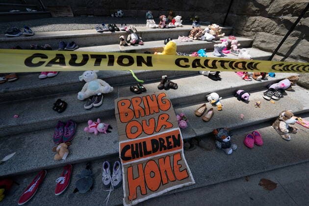 June 8, 2021, Vancouver, BC, Canada: Children s shoes are seen on the steps of the Holy Rosary Catholic Cathedral in downtown Vancouver, Tuesday, June 8, 2021. The shoes represent missing indigenous children after the remains of 215 children were discovered buried near the former Kamloops Indian Residential School. Vancouver Canada  - ZUMAc35_ 20210608_zaf_c35_089 Copyright: xJonathanxHaywardx