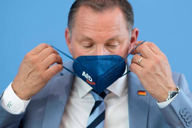 Tino Chrupalla, AfD DEU, Deutschland, Germany, Berlin, 07.06.2021 Tino Chrupalla, Parteivorsitzender der AfD, mit Maske Logo AfD waehrend der PK von der Partei AfD, Alternative fuer Deutschland, bei der Bundespressekonferenz einen Tag nach den Landtagswahlen in Sachsen-Anhalt in Berlin. en: Tino Chrupalla, leader of the right-wing party AfD, Alternative fuer Deutschland, Alternative for Germany, federal spokesman, with protection mask during a press call at the federal press conference, Bundespressekonferenz, the day after the elections in the eastern German state of Saxony-Anhalt in Berlin, Germany. The German CDU emerged in Saxony-Anhalt as the strong winner with 37.1% of the vote, soundly defeating the far-right Alternative for Germany