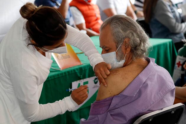 Pfizer Covid-19 Vaccination Campaign In Mexico A person receives a Pfizer BioNTech dose during mass vaccination campaign for people of 40 to 49 years old to immunize against Covid-19 disease at Campo Marte on June 10, 2021 in Mexico City, Mexico. Mexico City Mexico group-pfizerco210609_npkjT  Copyright: xEyepixx