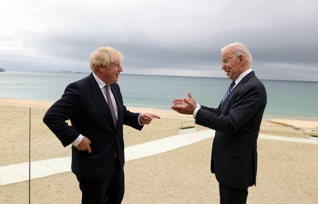 (210610) -- FALMOUTH (BRITAIN), June 10, 2021 -- British Prime Minister Boris Johnson (L) talks with U.S. President Joe Biden after their meeting in Carbis Bay, Cornwall, Britain, on June 10, 2021. Boris Johnson and Joe Biden on Thursday agreed to work to resume travel between the two countries and signed a new Atlantic Charter, as they met ahead of the Group of Seven (G7) summit. (Andrew Parsons No 10 Downing Street Handout via Xinhua) BRITAIN-CORNWALL-U.S.-PRESIDENT-VISIT HanxYan 