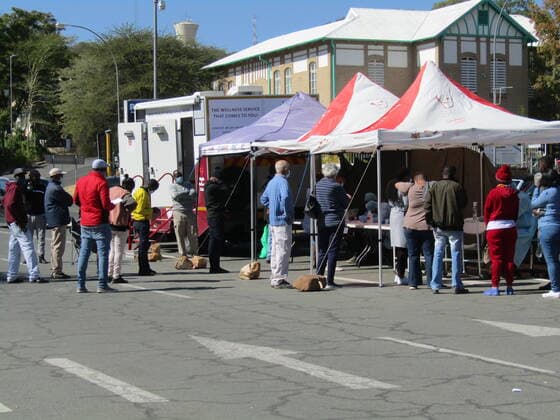 (210611) -- WINDHOEK, June 11, 2021 -- People line up to get COVID-19 tests at a testing site in Windhoek, Namibia, June 11, 2021. Namibia on Thursday recorded 1,045 COVID-19 cases, the highest daily increase since the coronavirus was reported in March last year, said Health Minister Kalumbi Shangula. (Photo by Xinhua) NAMIBIA-WINDHOEK-COVID-19-TESTING MusaxCxKaseke 