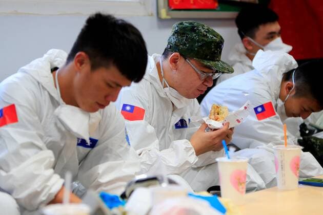 June 12, 2021, New Taipei, New Taipei, Taiwan: Chemical troops eat breakfast as they prepare for disinfection of public areas in New Taipei, a zone deeply affected by the community transmission of Covid-19. Taiwan has seen an increasing number of domestic cases and deaths related to the coronavirus while facing an inadequate supply of vaccines. New Taipei Taiwan - ZUMAs313 20210612_zip_s313_002 Copyright: xDanielxCengxShou-Yix