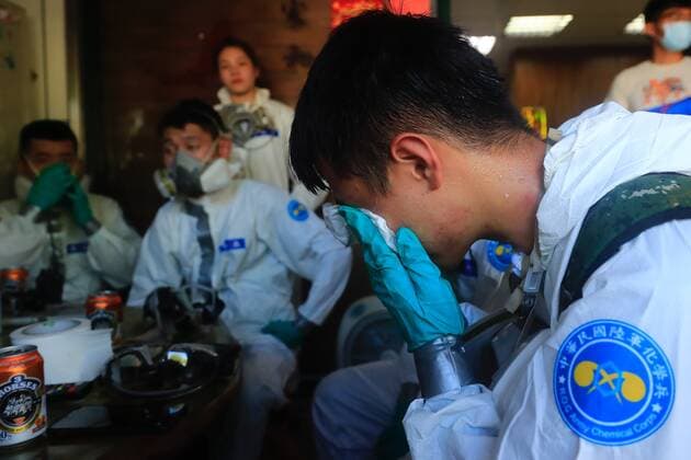 June 12, 2021, New Taipei, New Taipei, Taiwan: Chemical troops rest after disinfecting places in New Taipei, a zone deeply affected by the community transmission of Covid-19. Taiwan has seen an increasing number of domestic cases and deaths related to the coronavirus while facing an inadequate supply of vaccines. New Taipei Taiwan - ZUMAs313 20210612_zip_s313_013 Copyright: xDanielxCengxShou-Yix