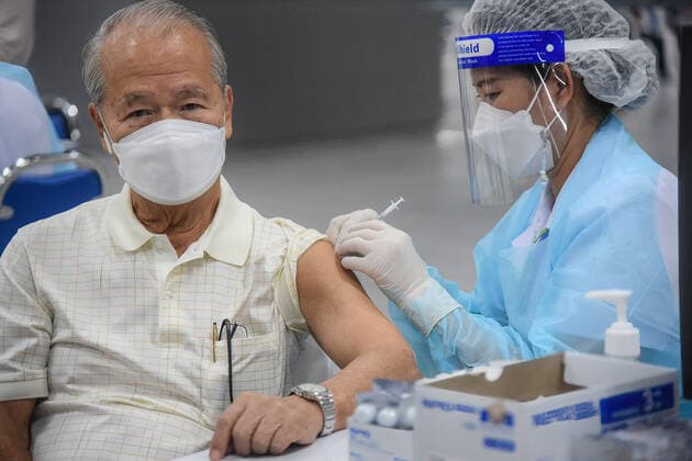 June 12, 2021, Bangkok, Thailand: A health worker administers the AstraZeneca Covid-19 vaccine to a man during a campaign to vaccinate the population against the Covid-19..On the vaccination progress, Ministry of Public Health reported, as of Friday, 5.97 million people got the vaccines. Thai government aims to inoculate 50 million people, or 70% of the population, by the end of the year. Bangkok Thailand - ZUMAs197 20210612_zaa_s197_156 Copyright: xYuttachaixKongprasertx