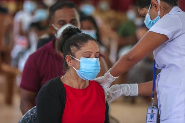 Second dose of Russian Sputnik V covid-19 vaccine in Colombo A health worker inoculates second dose of Russian Sputnik V Covid-19 vaccine in Colombo. Colombo Sri Lanka Copyright: SamanxAbesiriwardana