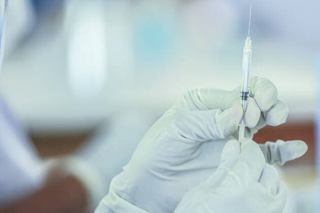 Second dose of Russian Sputnik V covid-19 vaccine in Colombo A health worker holding syringe with Sputnik V vaccine. Administering second dose of Russian Sputnik V Covid-19 vaccine in Colombo. Colombo Sri Lanka Copyright: SamanxAbesiriwardana